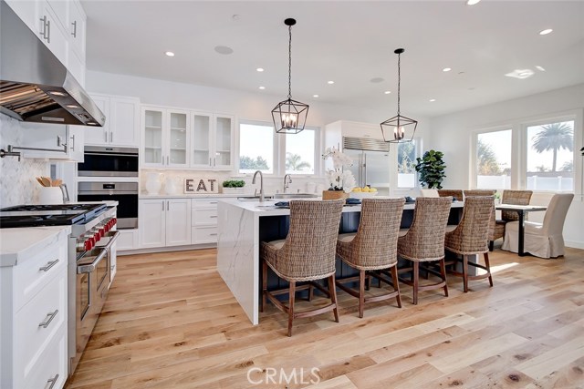 Large Island with waterfall countertop with prep sink