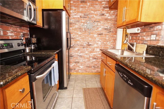 Granite counter tops and stainless appliances.