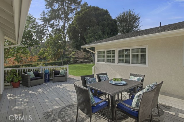 DECK LOCATED IN MIDDLE U-SHAPED HOME