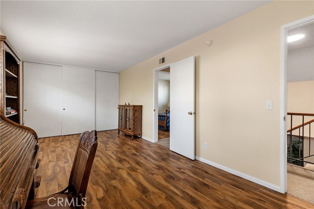 Stairway landing outside bedroom door. This is a large room with many possibilities and recently repainted.