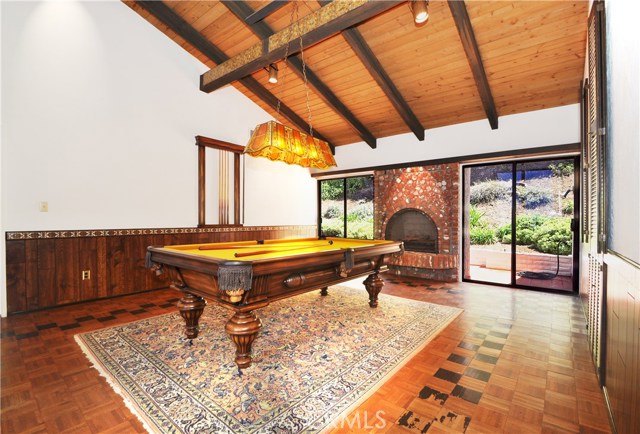 Upstairs bonus room/ second room family with fireplace looking towards backyard