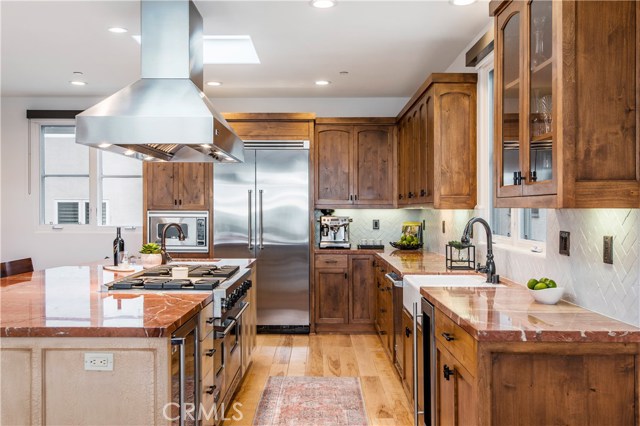 Gourmet kitchen features Alicante marble, stainless steel appliances and a gigantic island, powder room nearby along with open office with amazing views of the water.