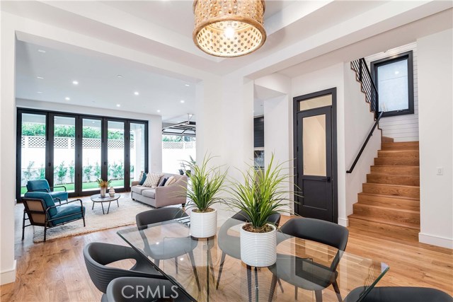 A feeling of spaciousness greets you. Note the unique, custom wood feature of the dining room ceiling.