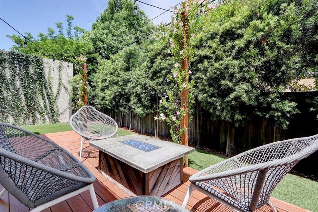 Custom outdoor lighting and fire pit make this the perfect backyard retreat.