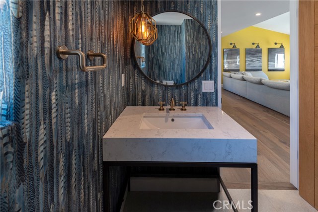 Custom finishes throughout, including this amazing powder room