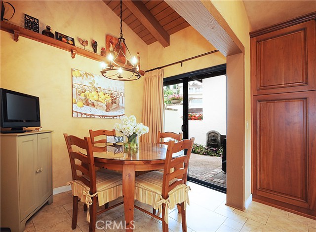 Kitchen nook for informal dining opens to courtyard.