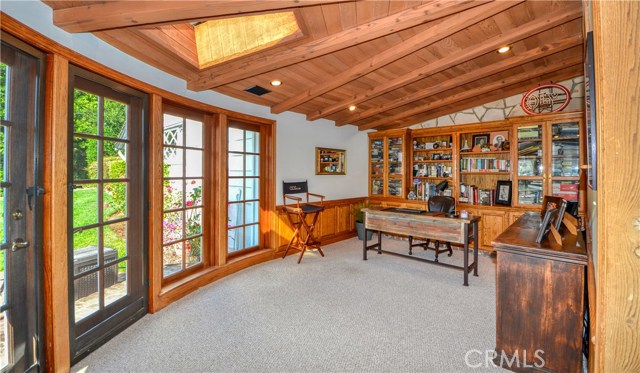 The library connected to the master bedroom is currently set up as an office and opens to one of the large patios.There is a second office area by the kitchen.