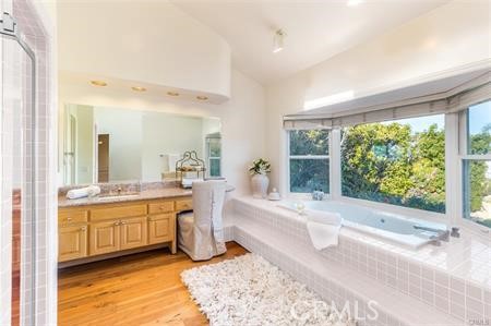 Spacious master bathroom features fabulous soaking spa tub, separate shower, 2 walk in closets, dressing area.