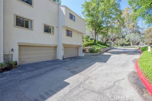 Private Drive to Garage which has direct access into Townhome