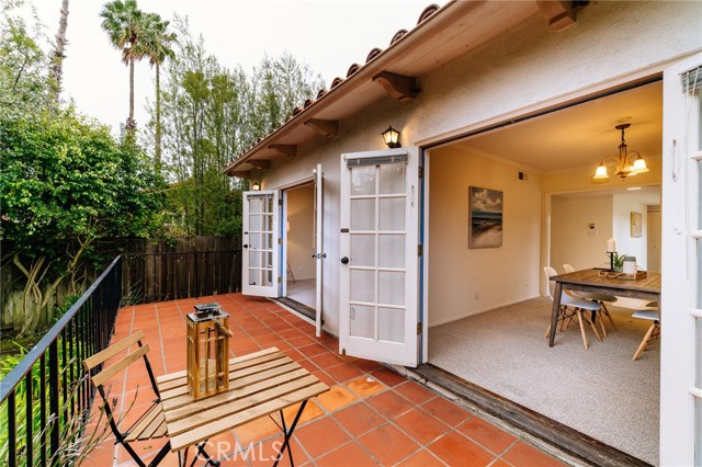 The veranda is a wonderful outdoor area for outdoor dining and relaxing in the mild Palos Verdes climate and adds to the homes charm.