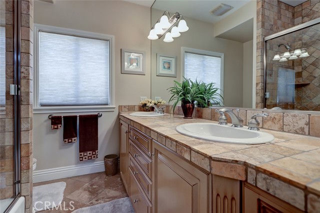 Beautifully detailed full hall bathroom with dual sinks!