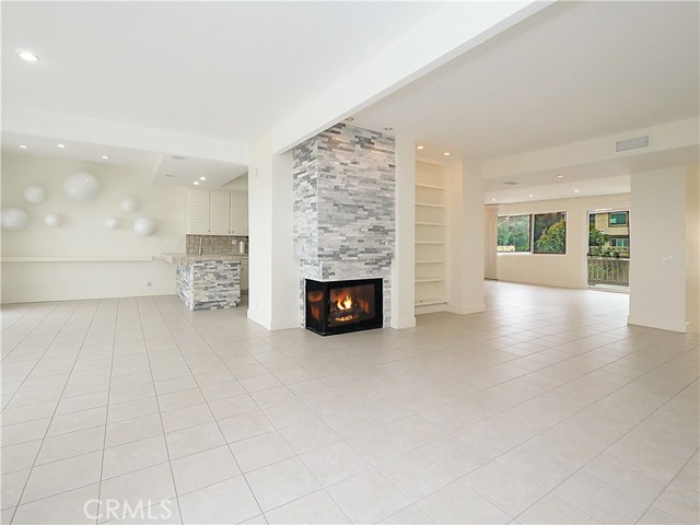 Living Room into Family Room and Dining Area Living Room into Family Room and Dining Area
