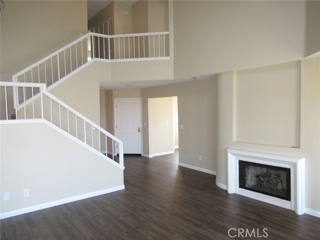 Living Room with 2 story Cathedral Ceilings and Fireplace.