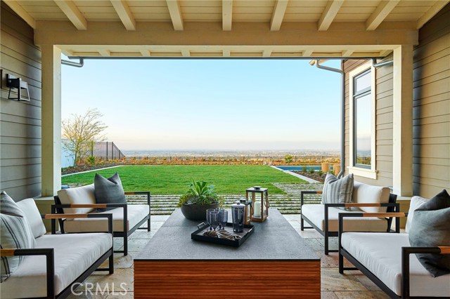 Covered patio off of the great room invites you to enjoy the views. Model home shown.