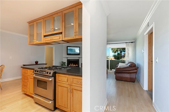 Front entry with kitchen to the immediate left and the hallway to bedrooms on the right.