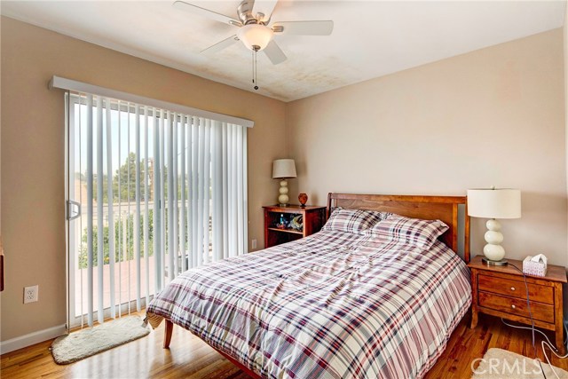 Bedroom #2 of the main house with tons of light and access to the large balcony overlooking the sparkling pool.