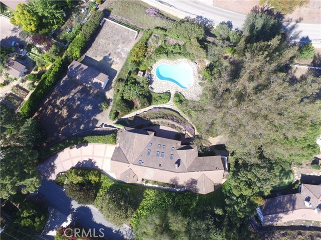 Aerial View of the property showing the great privacy and undeveloped land this home offers. Note the existing doublewide driveway and sky lights the home offers.