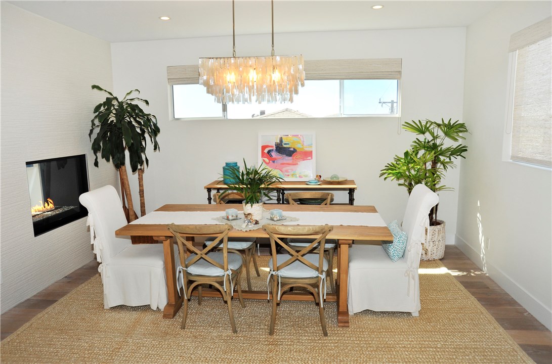 Dining area off kitchen with see through fireplace