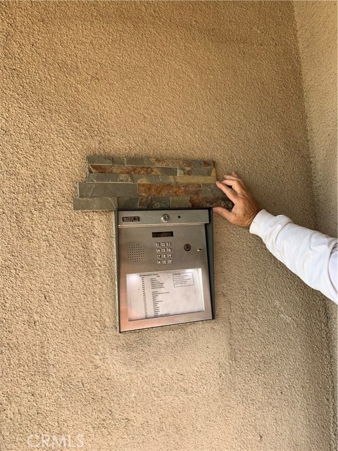 Seller is holding up a sample of tiles that may be used for exterior entrance remodel in the Spring. Call agent for details. Seller is holding up a sample of tiles that may be used for exterior entrance remodel in the Spring. Call agent for details.