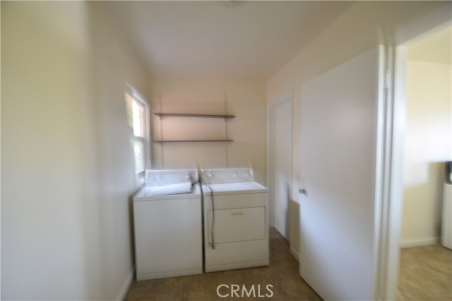 Laundry room is just off the kitchen, garage, and guest room/bath