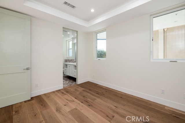 Generously sized first level bedroom with adjoining Hollywood style bath