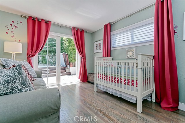 Guest bedroom with access to private south facing backyard.