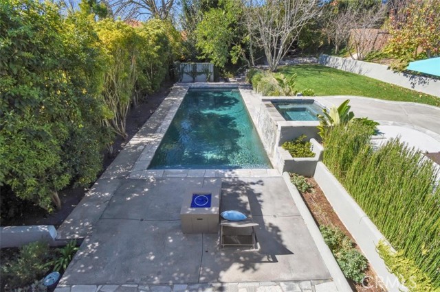 My favorite part of the home... a pool you can actually do laps in... new retaining wall, and new flower beds!