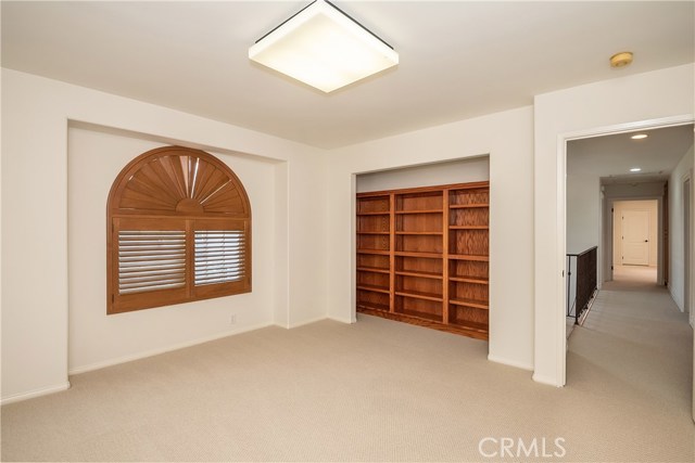 Upstairs bedroom #1 with built-in bookcases