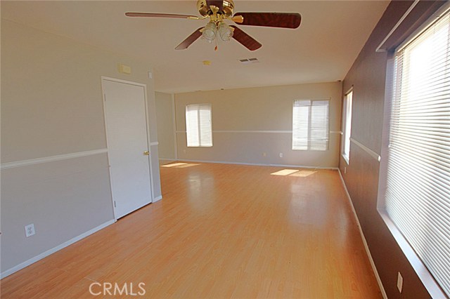 View of Living Room from Dining Area. Storage Closet, Lots of Windows for Plenty of Light and Smooth Ceilings.