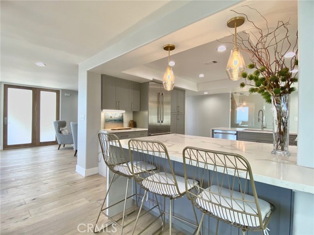 Open Floor Plan Breakfast Countertop with Entry in Background.
