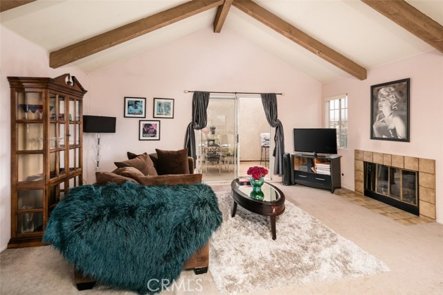 Living room features wood-burning fireplace and vaulted ceilings with deck and views. Living room features wood-burning fireplace and vaulted ceilings with deck and views.