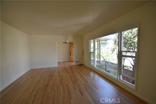 A wall of windows and original hardwood floors