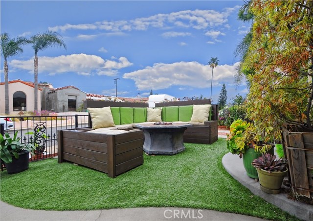 Cozy front yard sitting area with firepit