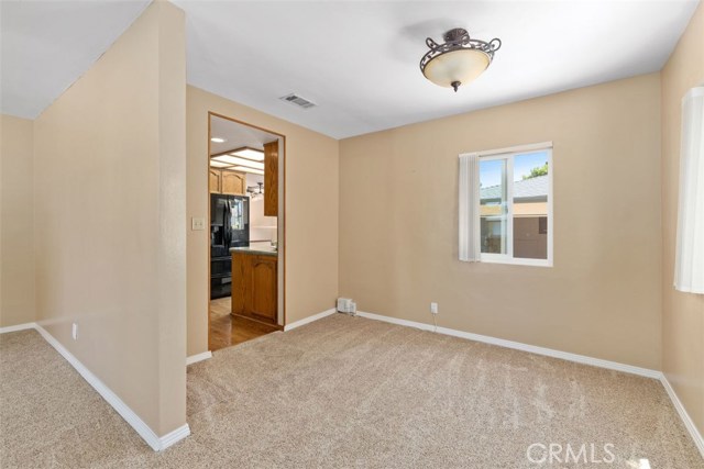 Sizable formal dining area off living room with direct kitchen access
