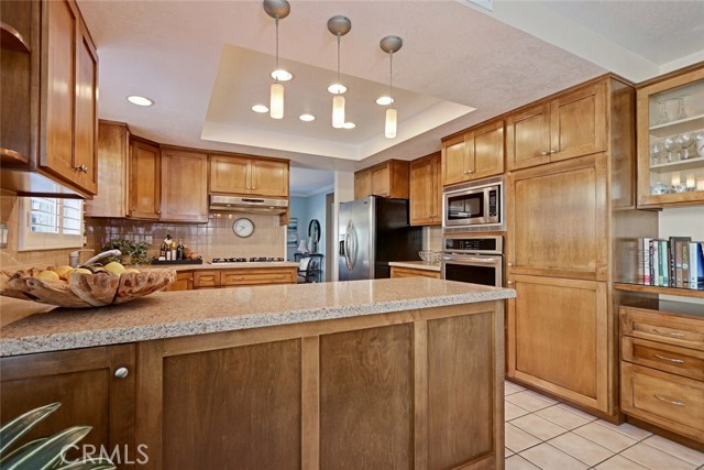 Kitchen Area with Granite Countertops and Stainless Steel Appliances