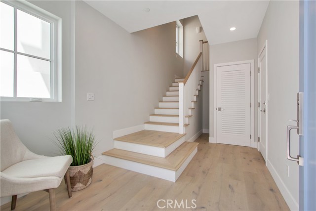 Open entry way.  Two car garage and  lots of storage.