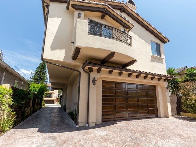 View of home from back.  Two-car garage has storage and direct access into the home.