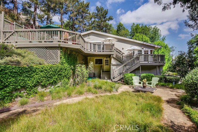 flat yard with views up to the multi level large decks - great for entertaining!!