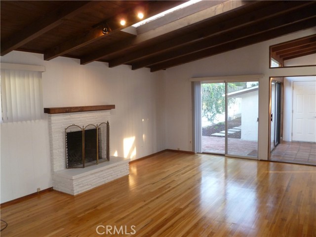 Family Room with Vaulted Ceilings, Skylights, and Fireplace