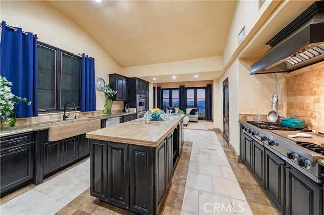 The kitchen as it looks towards the gorgeous ocean view! French doors lead to the patio for el fresco dining while you enjoy mesmerizing sunsets!