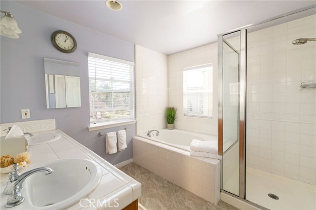 Master bath with shower and large jacuzzi tub