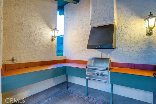 one of the many bbqs in the pool/community area near the pool & jacuzzi
