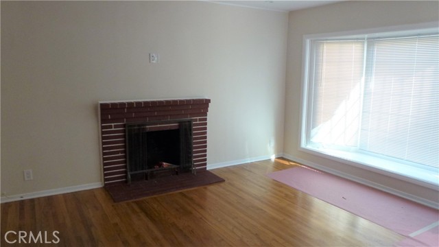 Living room with fireplace and bay window