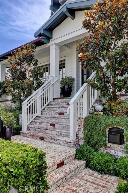 Entry features hand finished white brick and a viewing veranda