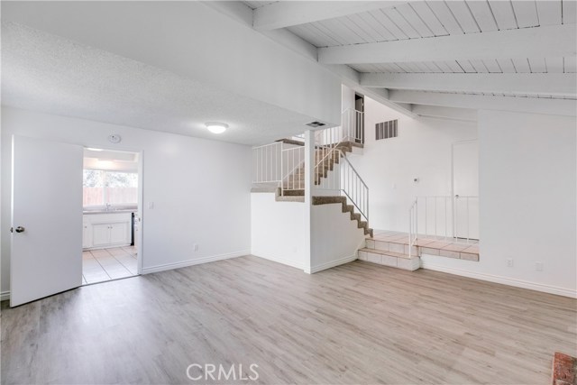 New laminate flooring in the living room as a wood finish and offer chic contemporary styling.