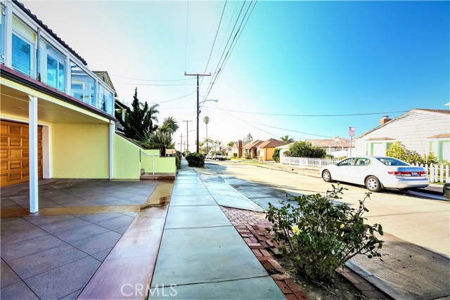 The home is located on a wonderful ocean view street in the Upper Hermosa Hill Section.  There is a 2-car garage, guest parking and a separate entrance into the lower level guest bedroom and bath.