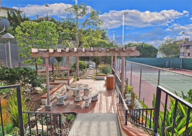 Patio overlooking tennis court