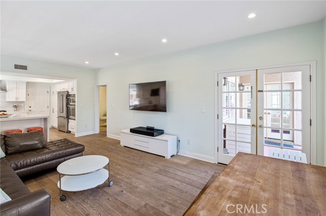 French doors open to backyard