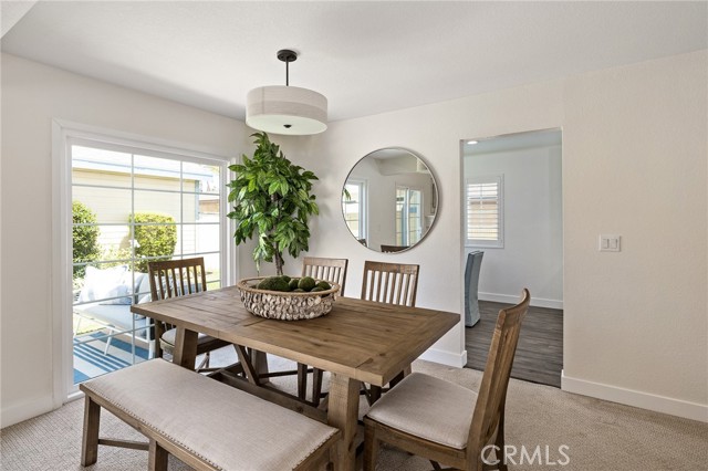 Dining room leading into the breakfast nook and kitchen.