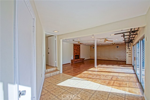 Another living room off the backyard. Probably used as a dance floor as there were once lights hooked up here.